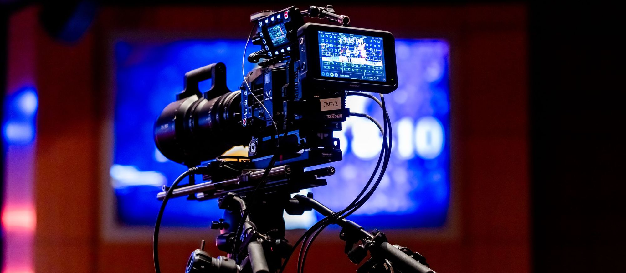 Cinema camera rig on a tripod in a television studio