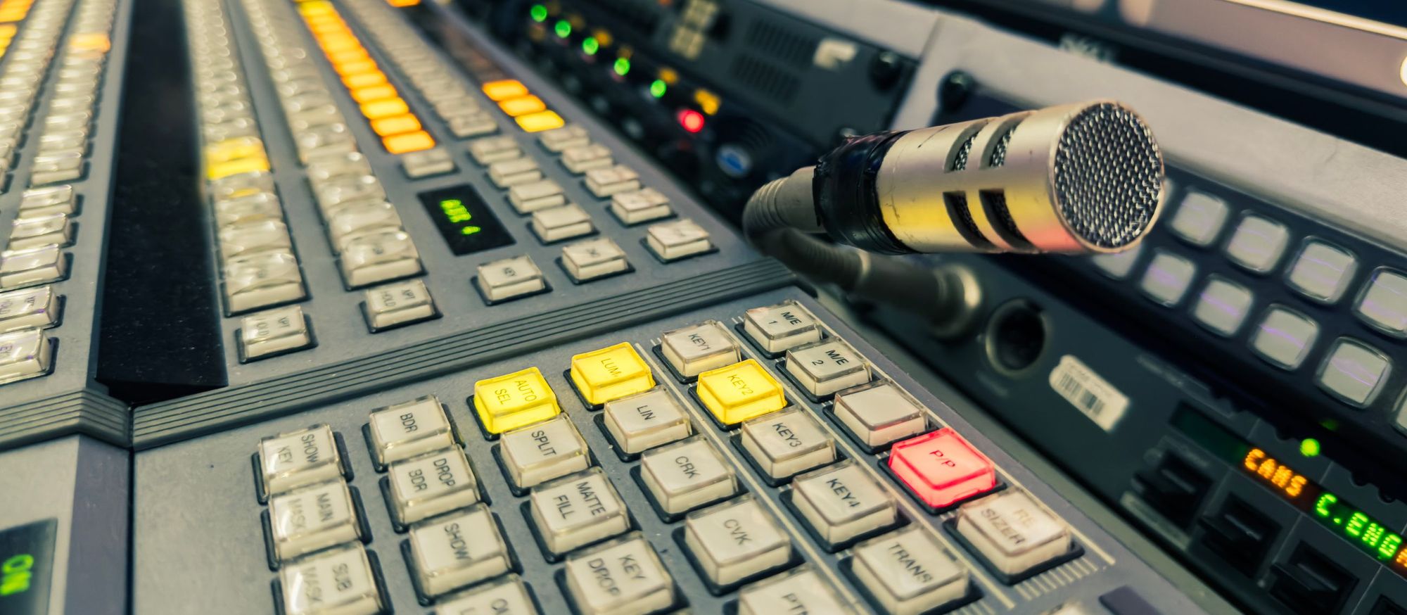 Broadcast vision mixer control panel with a talkback microphone