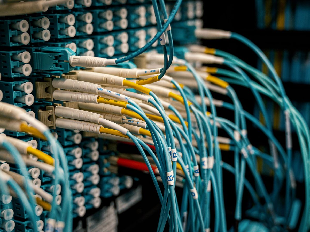 Fibre-optic patch cables connected to a network rack
